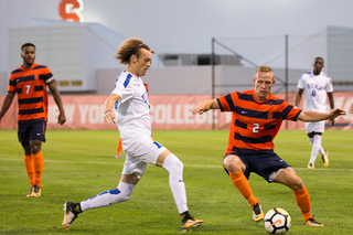 Jan Breitenmoser tries to take possession of the ball. He had a near-goal but goalkeeper Will Pulisic punched the ball away.