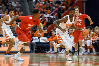 Syracuse guard Frank Howard drives the ball down the court.