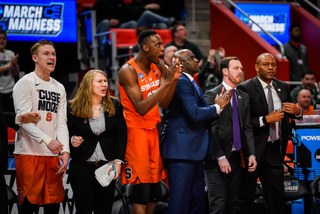 The bench reacts to the team's defense. Syracuse held off a typically high scoring team in TCU with strong play from the 2-3 zone. 