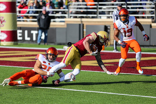 Kielan Whitner drags a BC player down just before the goal line.