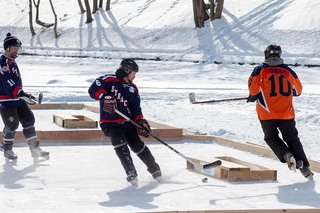 Two of the teams at the 2022 Syracuse Pond Hockey Classic battle for a victory. 