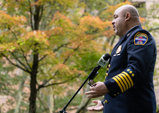 Michael J. Monds, 39, chief of Syracuse Fire Department, gives an interview to a video journalist from CNY Central (not in photo) after the service in remembrance of the victims of the 9/11 attacks. 