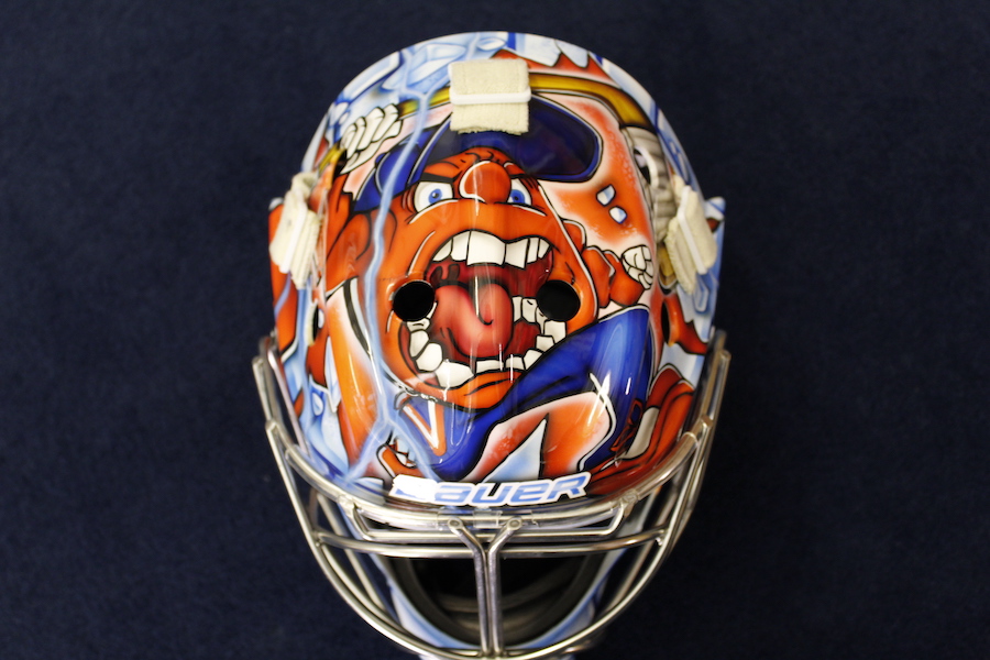 Allison Small’s mask displaying Otto the orange